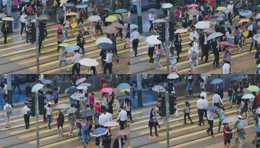 人们在雨天穿过城市的街道高清在线视频素材下载