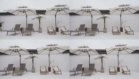 泳池边的休闲沙滩椅和遮阳伞高清在线视频素材下载