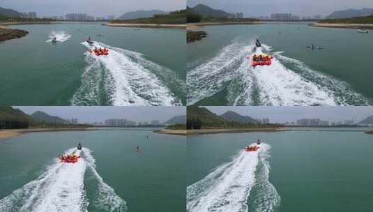 航拍海南三亚湾海面上行驶的游艇与摩托艇高清在线视频素材下载