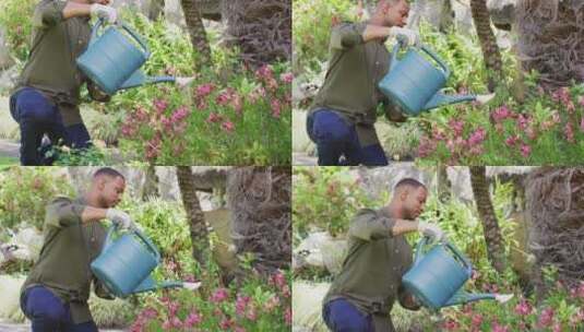 Biracial人园艺，用喷壶浇灌植物高清在线视频素材下载