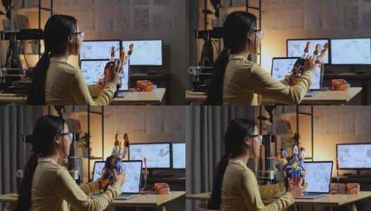 十几岁的亚洲女孩在家里的笔记本电脑上设计时组装电子手的后视图高清在线视频素材下载
