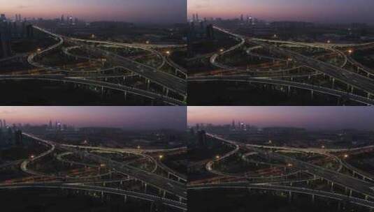 航拍城市天际线与高速公路立交桥高清在线视频素材下载