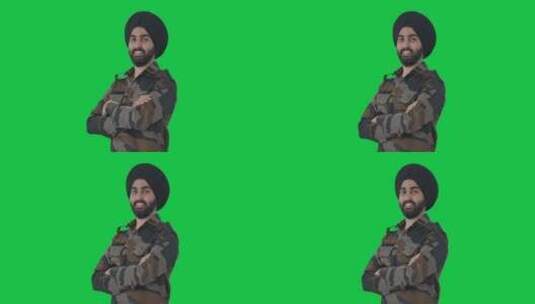 快乐的锡克教印度军人双手交叉站立的肖像绿高清在线视频素材下载