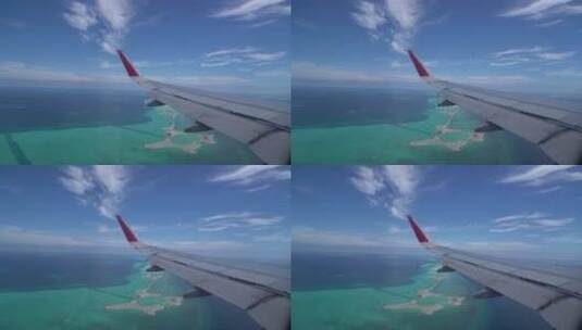 飞机机翼飞过海岛高清在线视频素材下载