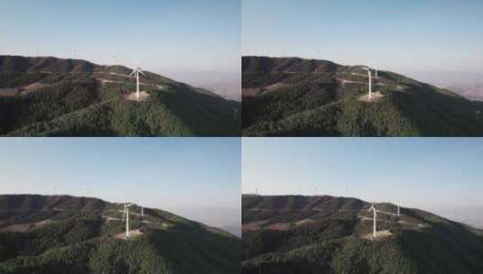航拍山上的风力发电大风车高清在线视频素材下载