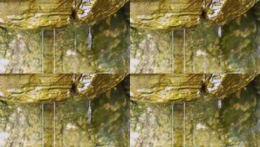 春天冰雪融化岩石苔藓流水泉水高清在线视频素材下载