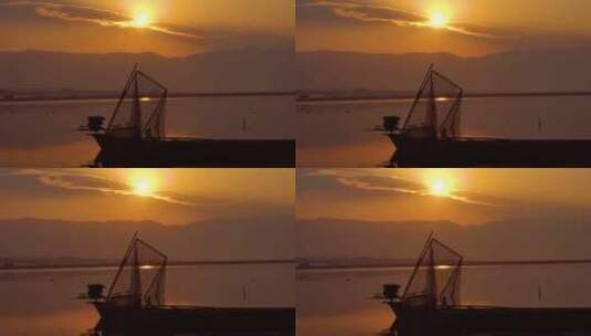 4K日出日落金色湖面渔船渔网高清在线视频素材下载