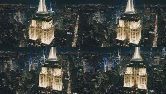 夜间在帝国大厦顶部的观景台周围飞行高清在线视频素材下载