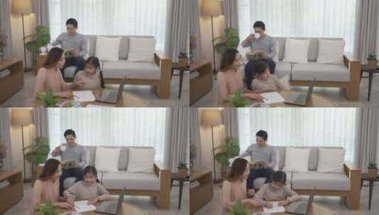 父母和女儿在家通过互联网学习。高清在线视频素材下载