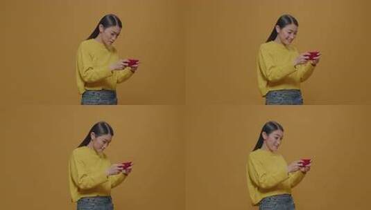 年轻人在手机上玩在线游戏高清在线视频素材下载