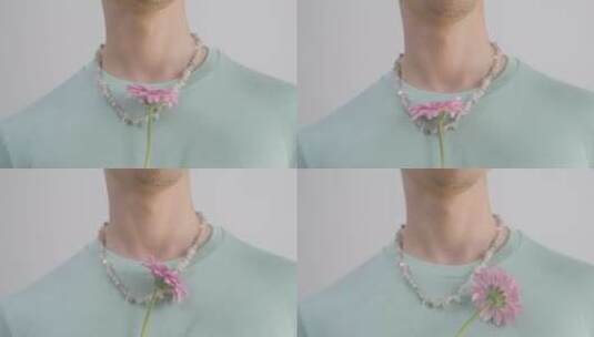 男人拿着鲜花在脖子上转动高清在线视频素材下载
