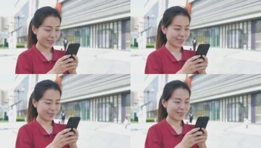 亚洲东方中国女性在商场内玩手机沟通联系高清在线视频素材下载