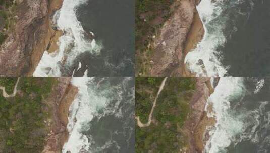 海浪拍打着海岸线的沙滩和岩石高清在线视频素材下载