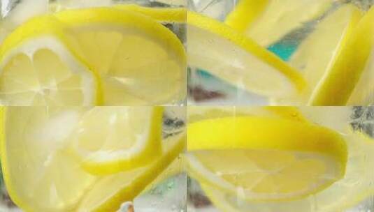 黄色的柠檬水加冰块特写镜头慢动作高清在线视频素材下载