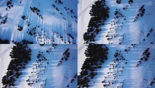 滑雪坡脚滑雪缆车与一群滑雪者和滑雪板爱好者的鸟瞰图。艾尔高清在线视频素材下载