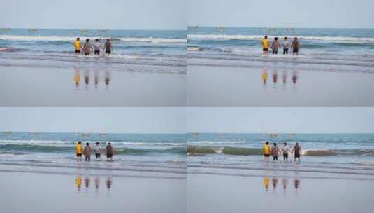 朋友在沙滩游玩高清在线视频素材下载