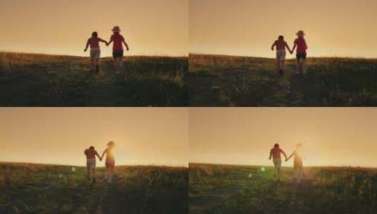夕阳下男孩和女孩牵手在田野奔跑高清在线视频素材下载