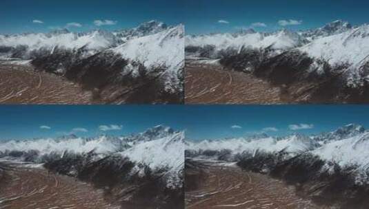 雪山峡谷视频青藏高原延绵的雪山盆地平原高清在线视频素材下载