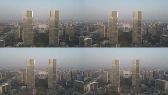 城市航拍郑州绿地双子塔地标建筑高清在线视频素材下载