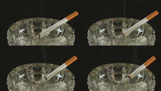 烟灰缸里燃烧的香烟高清在线视频素材下载