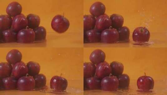 慢速红苹果水果旋转掉落在水面上高清在线视频素材下载