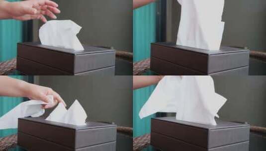 在纸巾盒抽出餐巾纸高清在线视频素材下载