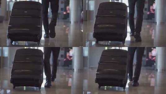 机场候机厅乘客拖着行李箱的特写高清在线视频素材下载