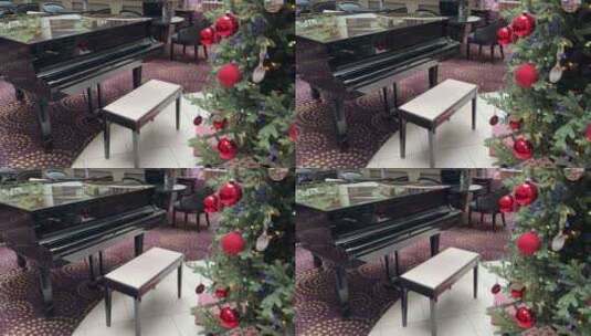 酒店圣诞树旁的大钢琴高清在线视频素材下载