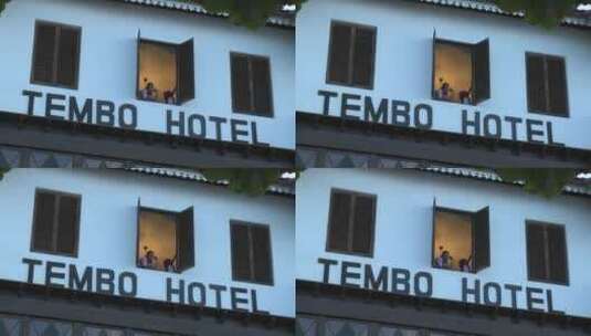 从酒店的窗户向外看的女孩高清在线视频素材下载