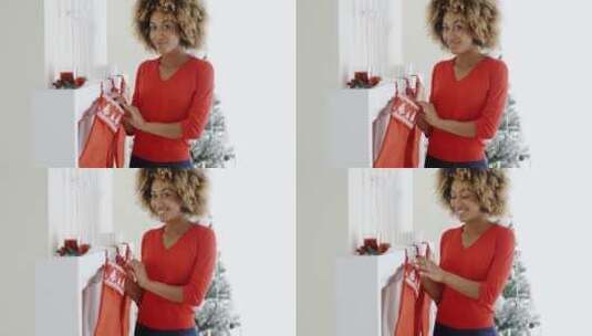 年轻女人挂着圣诞袜高清在线视频素材下载