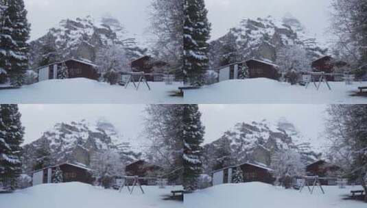 山脚下积雪覆盖的小屋高清在线视频素材下载