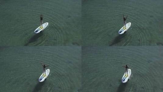湖中桨板上的女人高清在线视频素材下载