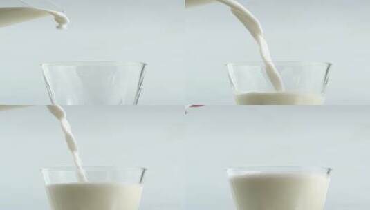 往牛奶杯中倒牛奶慢动作竖屏高清在线视频素材下载