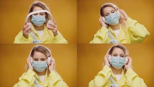 年轻女子戴着医用口罩在黄色背景下听音乐高清在线视频素材下载