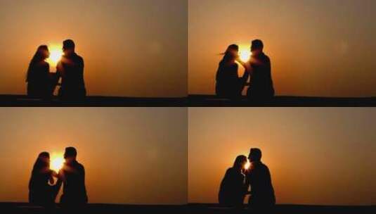 夕阳西下黄昏中拥抱的情人剪影高清在线视频素材下载