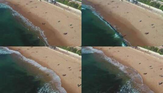 空中无人机拍摄冲浪者滑板在海海滩埃斯托里高清在线视频素材下载
