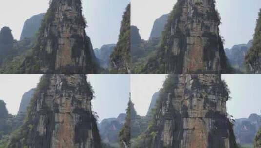 航拍结组攀登桂林阳朔拇指峰的攀岩者高清在线视频素材下载