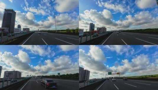 汽车行驶在高速路/蓝天白云/广角高清在线视频素材下载