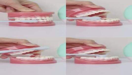 刷牙刷假牙操作视频高清在线视频素材下载