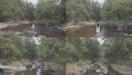 女子于溪边舒展双臂放松高清在线视频素材下载