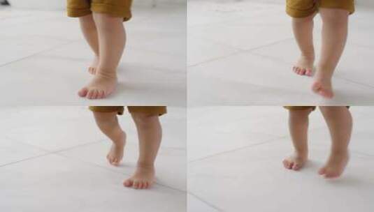 光脚婴儿在地板上学习走路高清在线视频素材下载