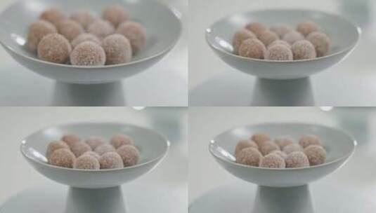 中式点心盘子里的山楂甜品果丹皮山楂球特写高清在线视频素材下载