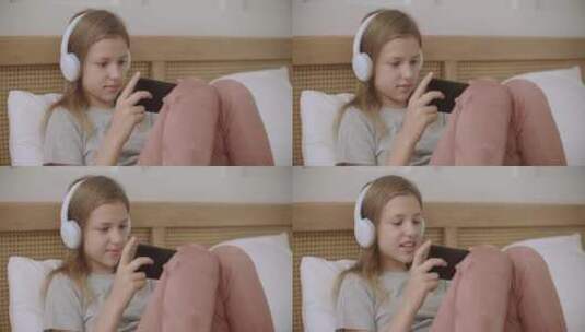 女孩在玩智能手机高清在线视频素材下载