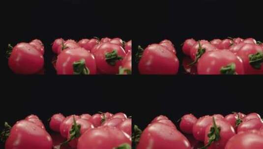黑色背景前旋转的番茄高清在线视频素材下载