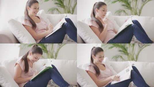 女孩坐在沙发上学习高清在线视频素材下载
