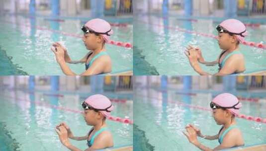 用运动相机在水中拍照玩耍的女孩高清在线视频素材下载