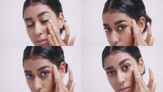 女人将眼霜涂抹在眼皮上特写高清在线视频素材下载
