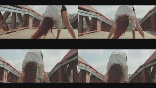 大桥上跳舞的女孩高清在线视频素材下载