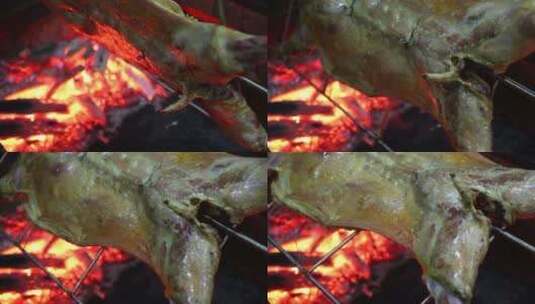 烤全羊过程烧烤切片翻面高清在线视频素材下载