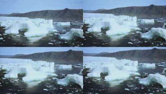 在宁静的水体中漂浮的冰山高清在线视频素材下载